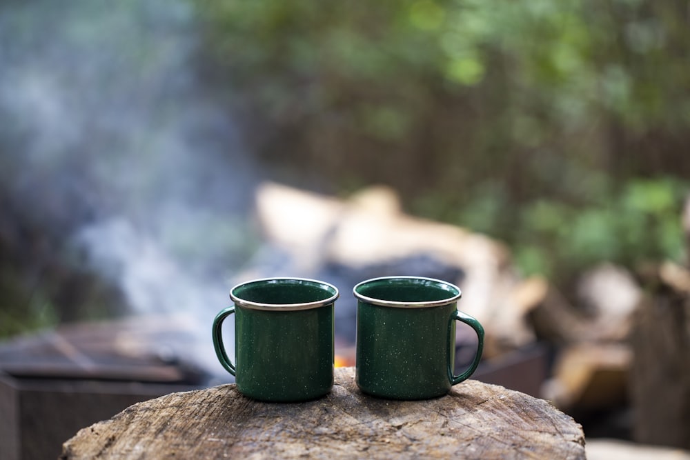 Two mugs, one log